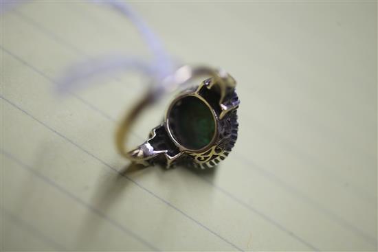 A yellow metal, cabochon emerald and white sapphire? cluster ring, size K.